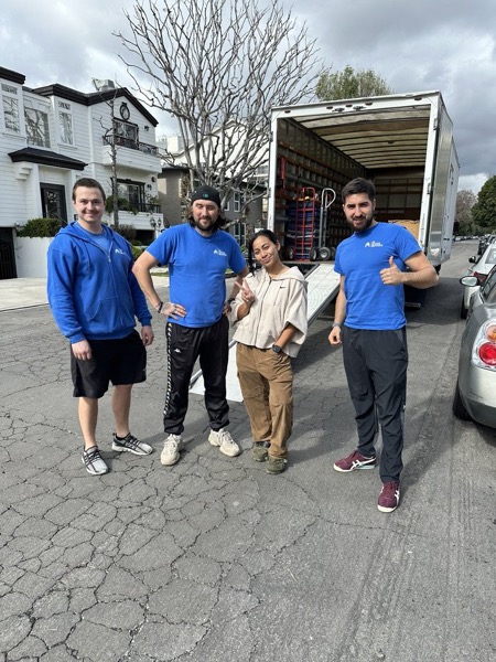 Team with customer by truck