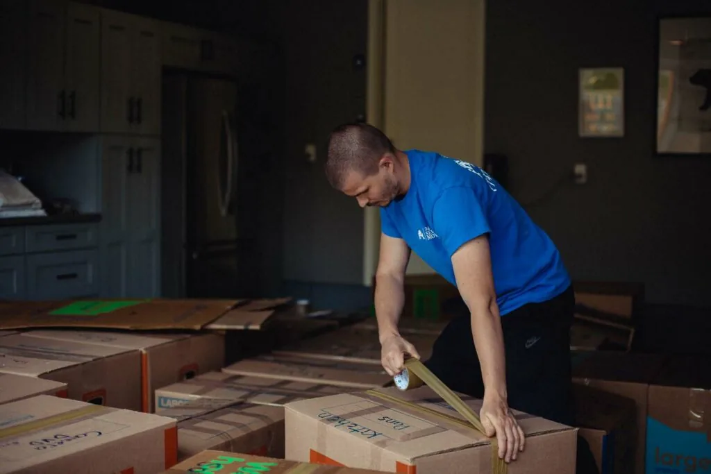 Professional movers wrapping client furniture in Sherman Oaks, CA